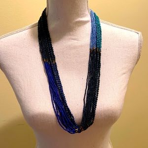 Multi strand beaded necklace in shades of blue